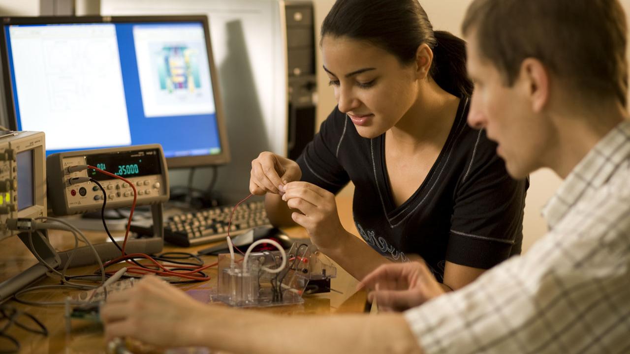 Electrical Engineering student working with professor